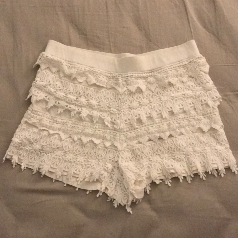 White, mid-rise lace shorts